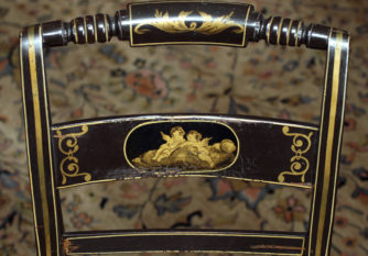 Detail of the back of an early American painted "fancy chair"