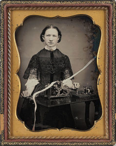Daguerrotype of a woman operating a telegraph